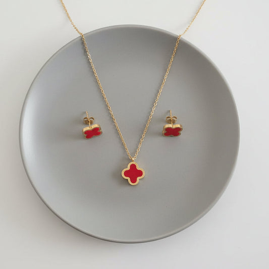 Gold necklace with red pendant and matching earrings